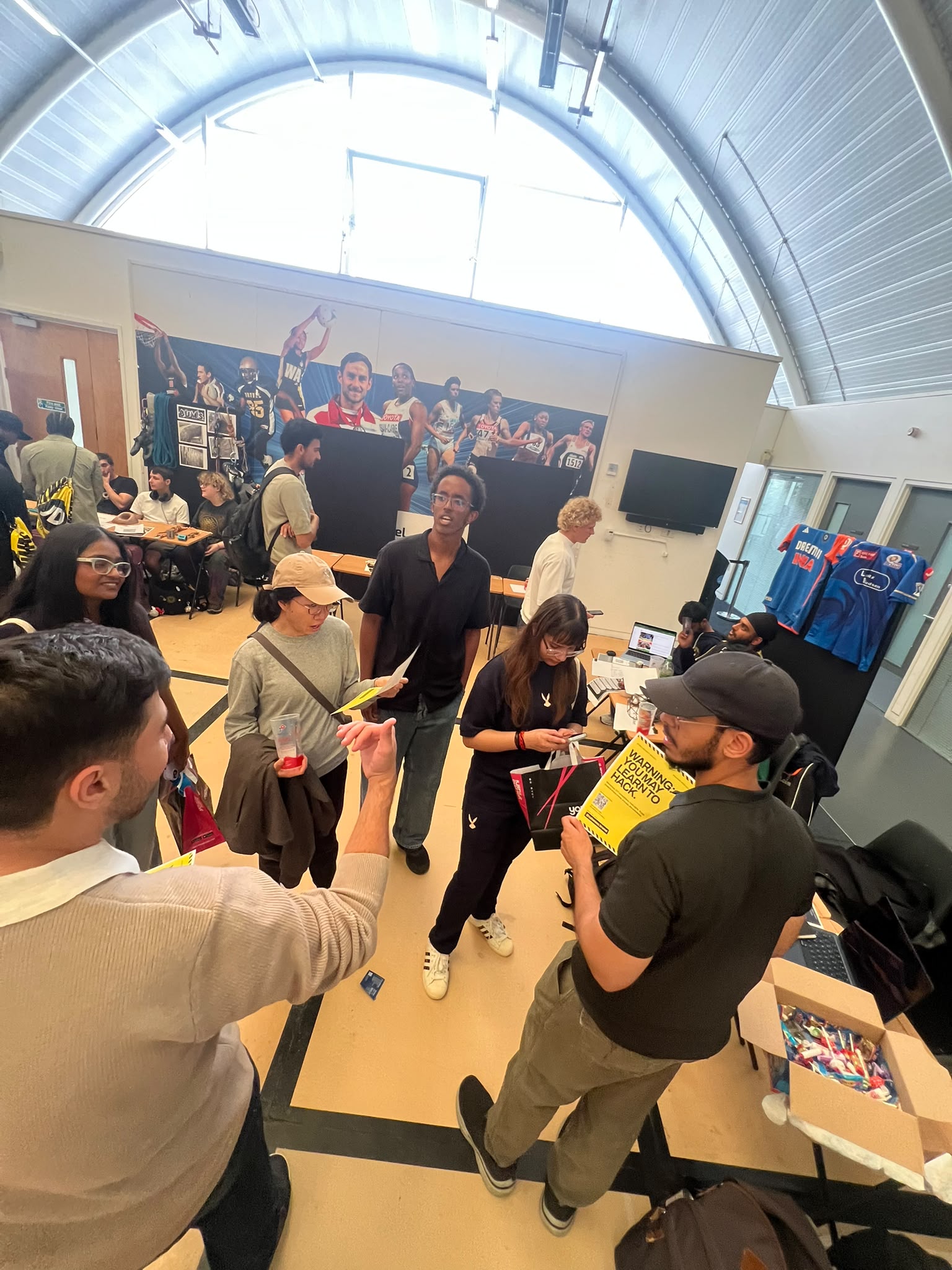 Students gathered around the Brunel Cyber Security Society Freshers stall
